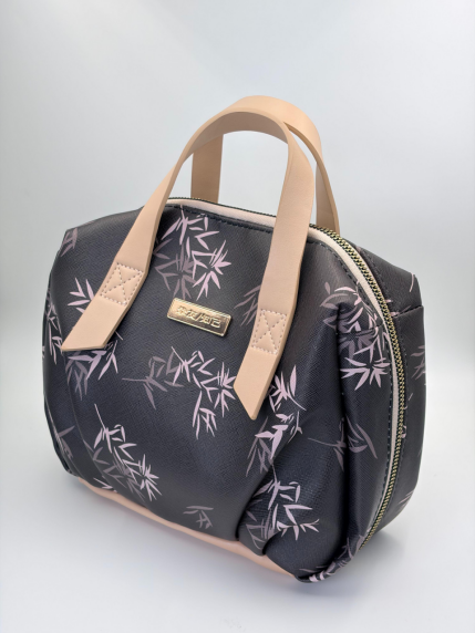 Cosmetic bag with a woven label and leather handles